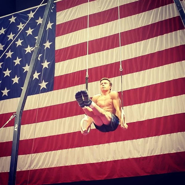 Brody Malone holding the United States flag